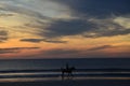 A horseback rider silhouette with the sunrise coming up Royalty Free Stock Photo