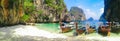 Island beach with limestone rocks and long tail boats Royalty Free Stock Photo