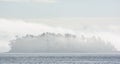 Island covered in mist in Pacific Northwest