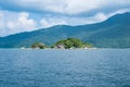 Island green rock mountain on middle sea Royalty Free Stock Photo