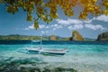 Island hopping trip El Nido. Incredible dreamlike exotic scenery with traditional filippino banca boat resting in Royalty Free Stock Photo