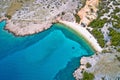 Island of Krk idyllic pebble beach with karst landscape aerial view, stone deserts of Stara Baska