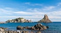 Island Lachea and a sea stack, geological features in Acitrezza (Sicily)