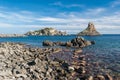 Island Lachea and a sea stack, geological features in Acitrezza Sicily