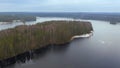 Island in a Mednoye lake among a large northern forest in deep autumn