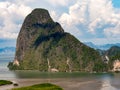 Island mountain sea blue sky white cloud. Landscape abundant nature tropical limestone karst mountain overgrown dense green tree. Royalty Free Stock Photo