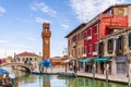 The blue glass comet and the clock tower at Murano in Venice in Veneto, Italy Royalty Free Stock Photo