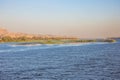 A island in the Nile with distant cruise ships