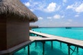 Island in ocean, Maldives. Villa on piles on water