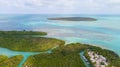 Island in ocean. Small green uninhabited beach or tiny desert island. Blue-turquoise color Gulf of Mexico water. Beautiful wildli