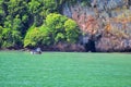 Island, Ocean views near Phuket Thailand with Blues, Turquoise and Greens oceans, mountains, boats, caves, trees resort island of