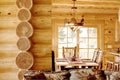 The dining room in a modern log home . Royalty Free Stock Photo