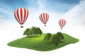 Island piece of land with forest and hot air balloons floating i Royalty Free Stock Photo