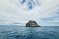 Island rock pinnacle in wide open ocean sea with cloud blue sky background landscape in Thailand Royalty Free Stock Photo