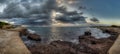 The island`s first nudist beach, with an extensive sandy area topped by a stone defensive tower Royalty Free Stock Photo