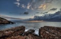 The island`s first nudist beach, with an extensive sandy area topped by a stone defensive tower Royalty Free Stock Photo