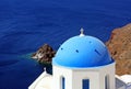 The island Santorini in Greece. Greek church with blue roof, sea Royalty Free Stock Photo