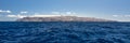 Island silhouette of la Gomera from a boat in the ocean Royalty Free Stock Photo