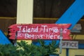 Island Time begins here - red sign with white lettering Royalty Free Stock Photo