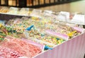 island type candy shop, market stand with boxes of colorful candy, sweets in transparent containers