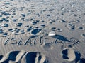 ISLANDA handwriting on black sand beach, Iceland Royalty Free Stock Photo