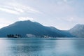 Islands of the Bay of Kotor against the backdrop of mountains and a cloudy sky. Montenegro