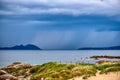 Rain over the stormy sea. Storm clouds and sea composition.. Views from Samil beach on a rainy afternoon with the Cies Islands Royalty Free Stock Photo