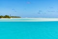 Perfect turquoise clear water, blue sky, white sand, small island, Pacific Island, Aitutaki