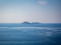 Islands in the rough sea. Islands in the middle of the blue sea. Distant islands in the middle of the sea. Royalty Free Stock Photo