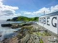 Islay, Scotland - Sseptember 11 2015: The sun shines on Ardbeg distillery warehouse Royalty Free Stock Photo
