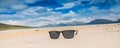 Isle of Harris landscape - sunglasses on a beach, beautiful endless sandy beach and turquoise ocean Royalty Free Stock Photo