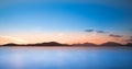 Isle of Harris landscape - sunset sky over mountains, beautiful endless sandy beach and turquoise ocean Royalty Free Stock Photo