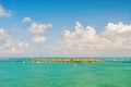 Isle land and sailboats in turquoise sea in key west, usa. Seascape with sailing boats on cloudy blue sky. Sailing and