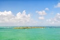 Isle land and sailboats in turquoise sea in key west, usa. Seascape with sailing boats on cloudy blue sky. Sailing and yacht race.