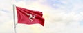 Isle of Man flag waving on sky background