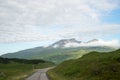 Isle of Mull Scotland UK countryside scene with Ben More mountain and a single track road