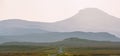 Isle of Skye - misty island landscape - hills silhouette covered in mist Royalty Free Stock Photo