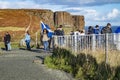 Isle of Skye , Scotland - October 14 2018 : Tourists visiting the Kilt Rock waterfall by Staffin