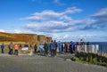 Isle of Skye , Scotland - October 14 2018 : Tourists visiting the Kilt Rock waterfall by Staffin