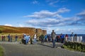 Isle of Skye , Scotland - October 14 2018 : Tourists visiting the Kilt Rock waterfall by Staffin