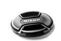 Nikon brand lens cap isolated on white background