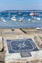 Isles of Scilly - compass rose imprinted on a metal plate at the town beach of Hugh Town on St.Mary`s Royalty Free Stock Photo