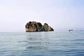 An islet along the coastline. Sailing boating boat ride.