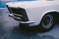 Vintage Retro 1965 White Buick Riviera GS in perfect conition parked on sunny day after the rain