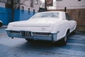 Vintage Retro 1965 White Buick Riviera GS in perfect conition parked on sunny day after the rain