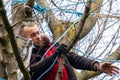 ISLINGTON, LONDON, ENGLAND- 18 November 2020: Save Our Trees protester in a tree at Dixon Clark Court
