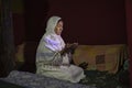 Ismaili muslim woman during afternoon prayers at her home in Shimshal village