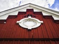 A beutiful traditional Finnish barn, with a decorative round window Royalty Free Stock Photo