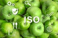ISO 22000 - Food safety management. Fresh apples as background Royalty Free Stock Photo