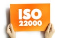 ISO 22000 - Food safety management system which provides requirements for organizations in the food industry, text concept on card